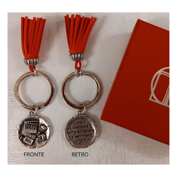 P/chiavi in ottone bagno argento LAUREA DAMS con nappa in similpelle e scatola DIAM.2,5 CM il ciondolo.MADE IN ITALY