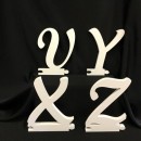Lettere (solo come iniziale)  di legno in corsivo maiuscolo. H 23x15 circa.