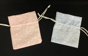 Sacchetto tessuto con stampa stelline. CM 10x9