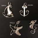 Ciondolo ottone con bagno argento, soggetti mare. CM 4 circa MADE IN ITALY