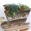 Slitta in legno con LED, rami, bacche e decorazioni. CM 25x9 H 21
