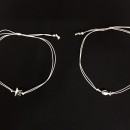 Bracciale doppio filo con ciondolo passante, nodo scorsoio.